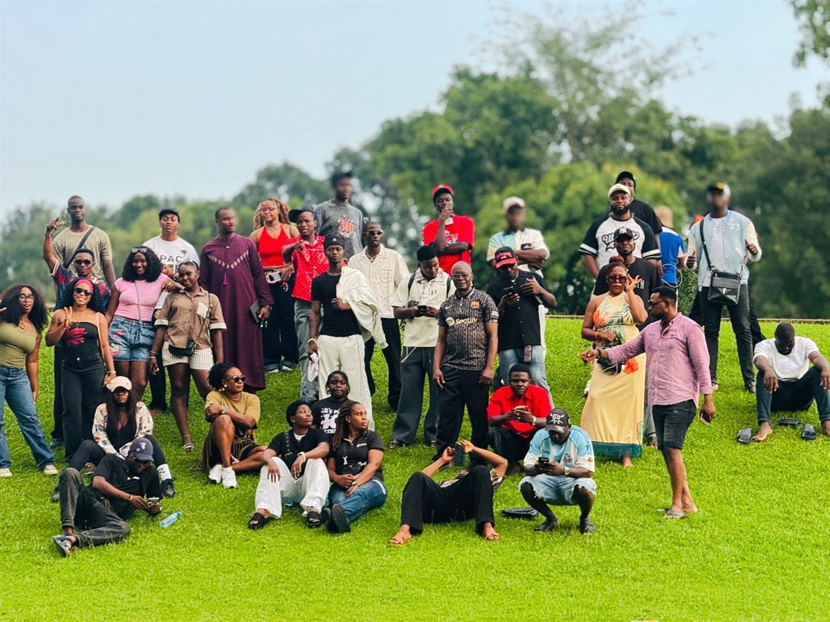 The G:Lite Hub community smiling on the green hillside in Dutse
