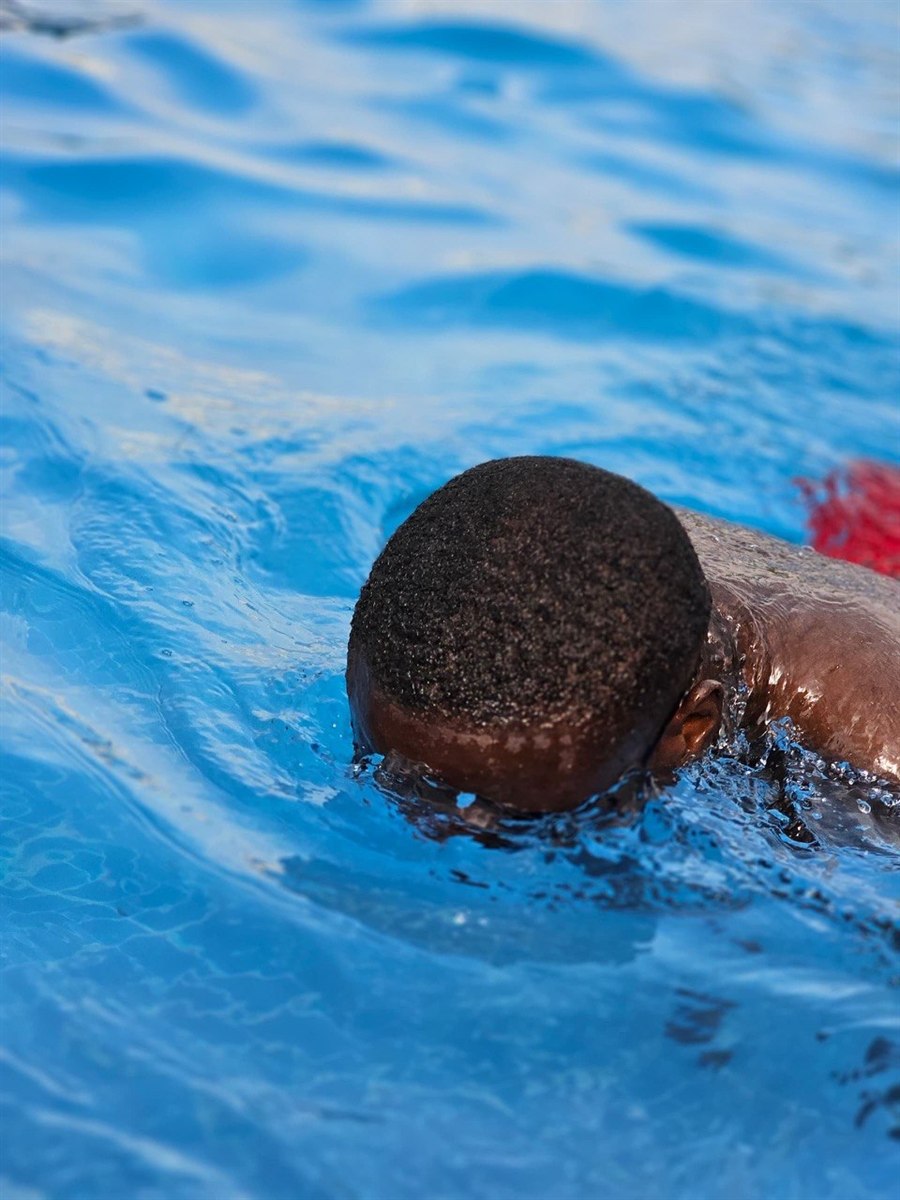 Swimmer practicing strokes in the swimming pool