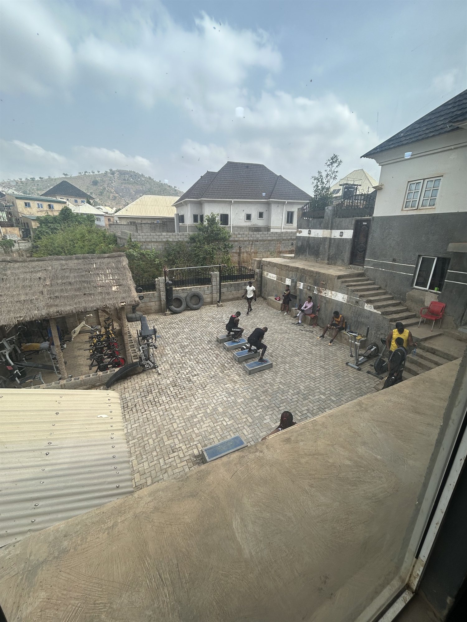 Outdoor fitness courtyard at G:Lite Hub with mountain view in Dutse
